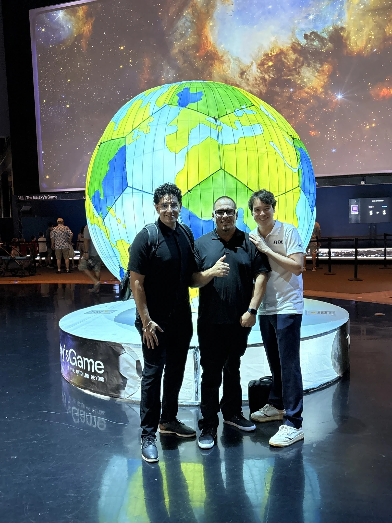 Mars Bay TV team during a FIFA-related production at a large globe exhibit